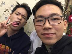 Two friends taking a playful selfie in Hanoi