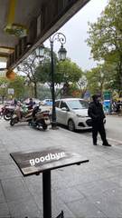 A café table beside a Hanoi street