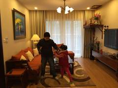 Two children playing in the living room