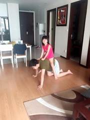 A child playing on another child’s back at home
