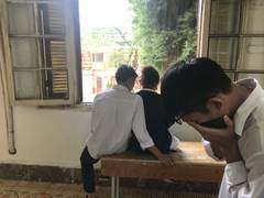 Students beside an open classroom window