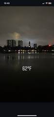 City lights reflected in a lake at night