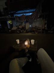 Drinks on a small street table at night