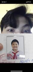 An old school portrait held up to the camera
