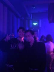Friends under purple lights