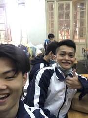 Friends taking a selfie in school jackets