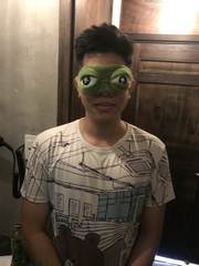 A playful portrait with a frog sleep mask