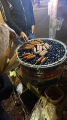 Sausages cooking at a street stall
