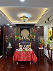 A table of food in front of a decorated altar